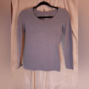 Long sleeve gray top.